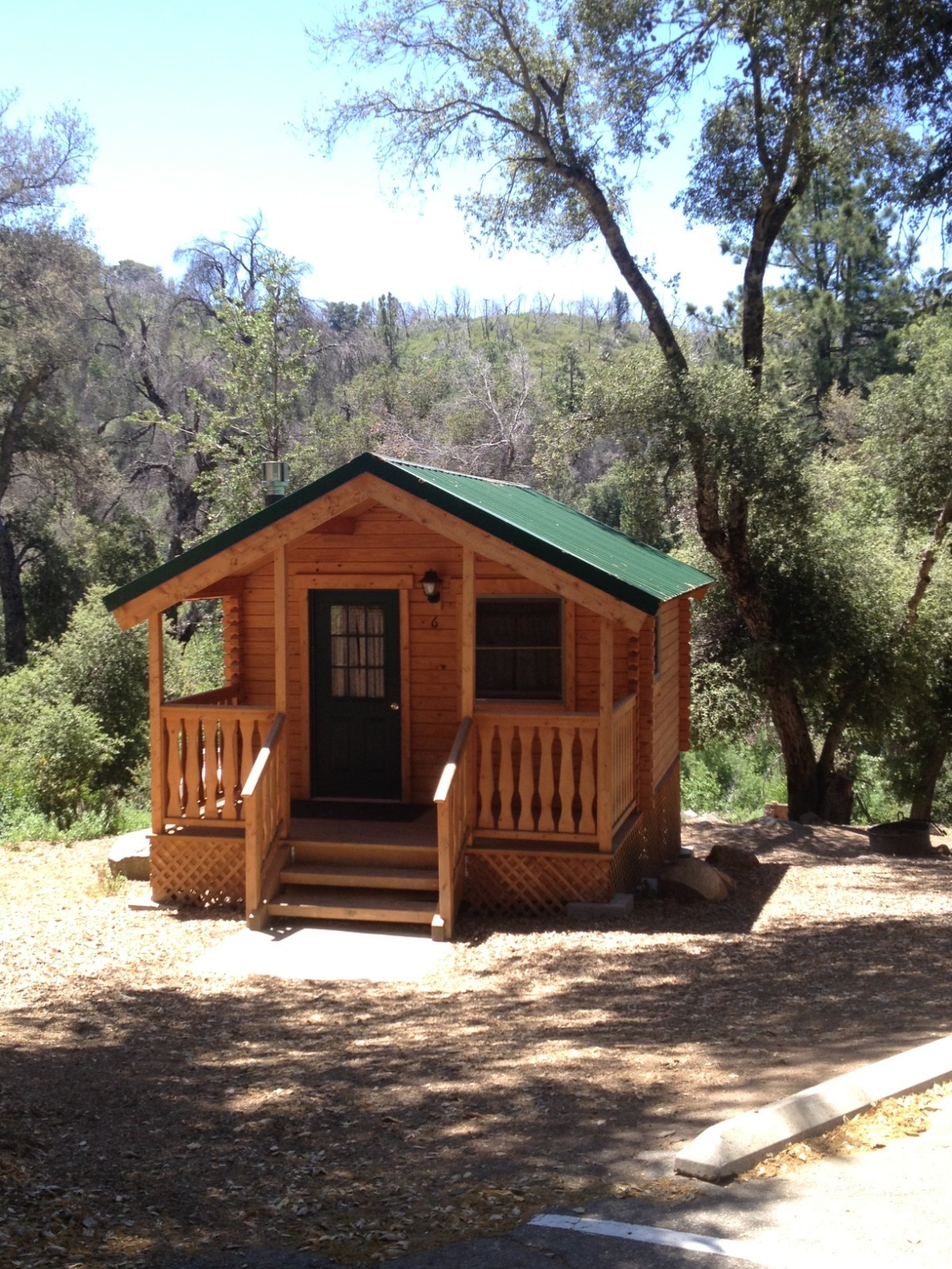 New Condition 10×12 Log Cabins with a 6′ Gable Covered Porch