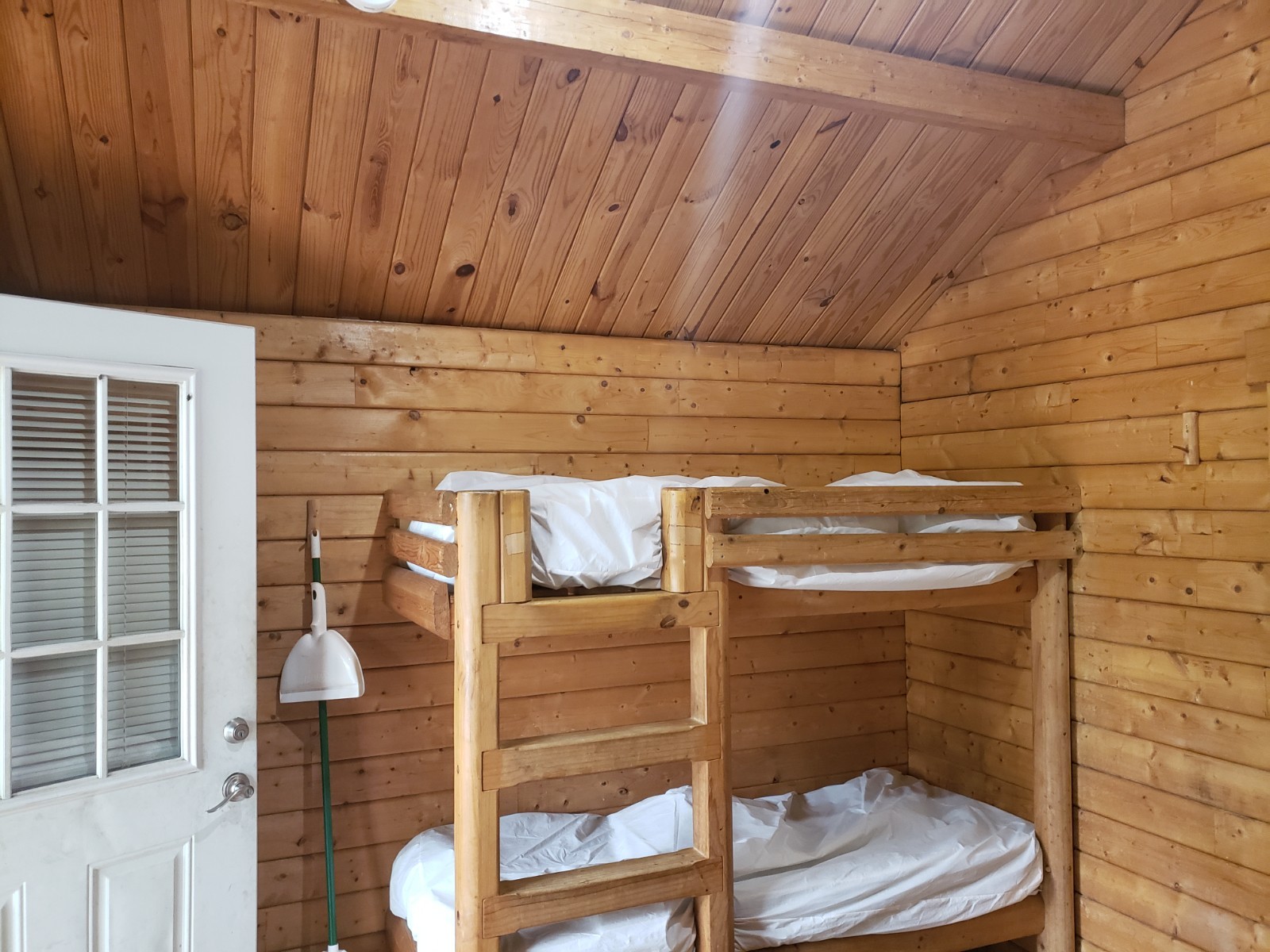 New Condition 10×12 Log Cabins with a 6′ Gable Covered Porch